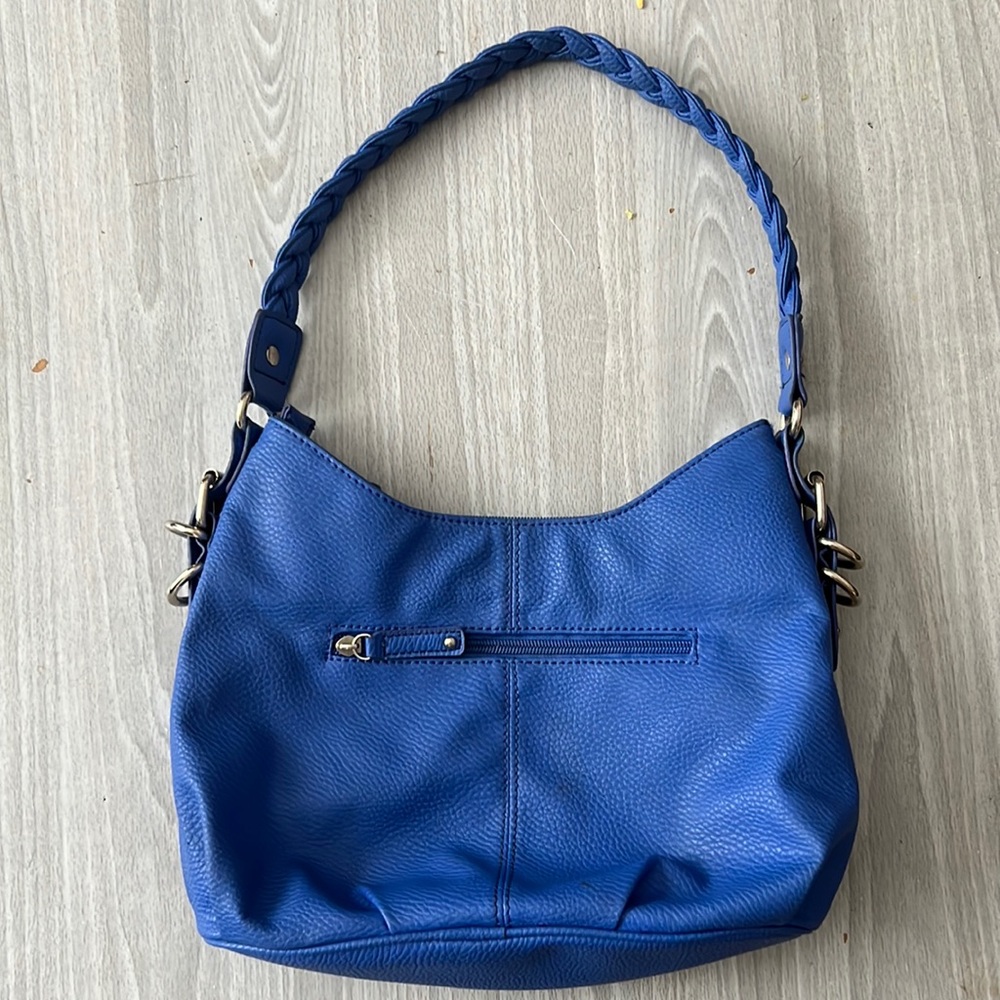Colbalt blue.  Braided handle.  Slightly used.  Two zip pockets .